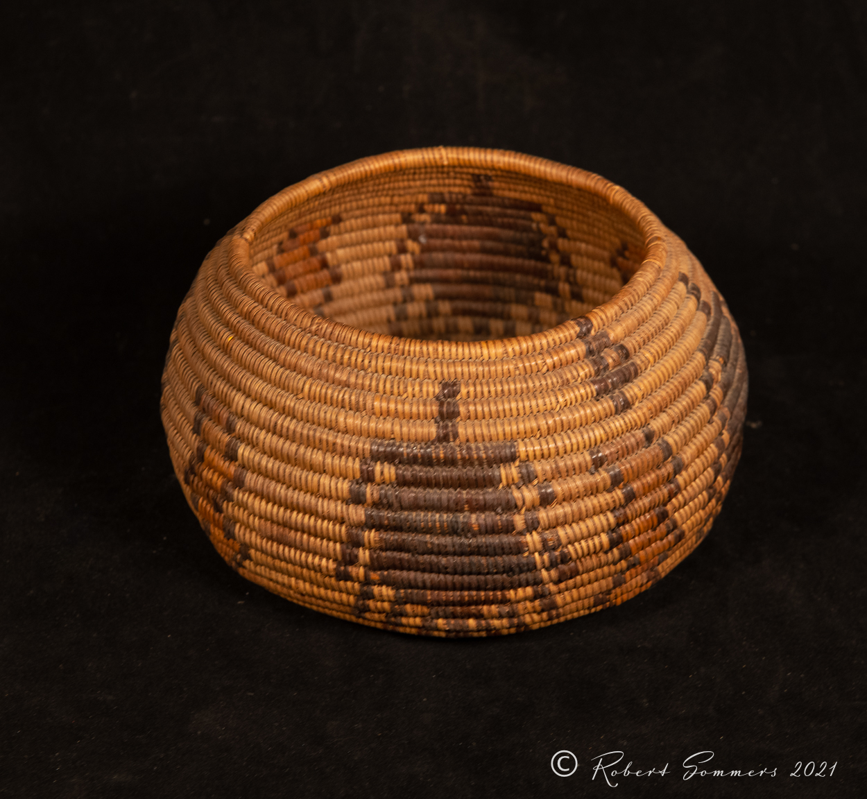 Mission Indian basket with spiders